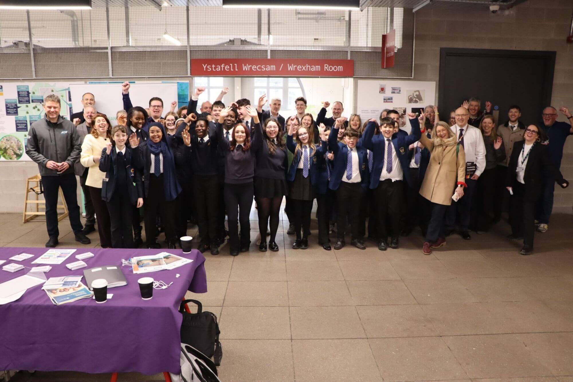 Group of adults and young people in Ty Pawb